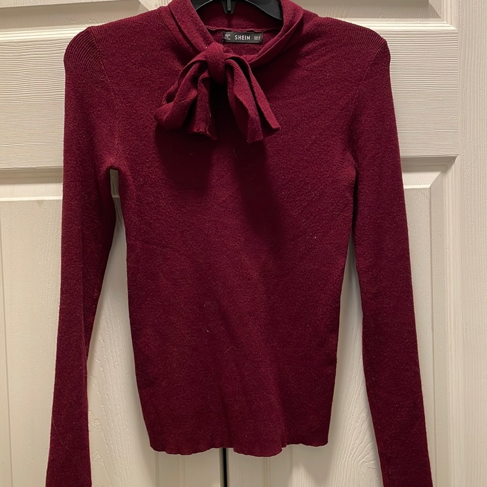 Size S maroon sweater with bow detail at neckline